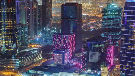 The skyline of the West Bay area from top in Doha timelapse, Qatar. Illuminated modern skyscrapers...