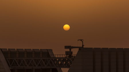 Aerial top view of West Bay and Doha City Center during sunrise timelapse, Qatar. Modern skyscrapers rooftop. Close up viewの写真素材