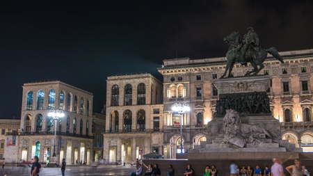 Vittorio Emanuele II statue at Piazza del Duomo timelapse at night. Milan in Lombardy, Italy. Museum...