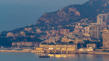 Cityscape of Monte Carlo with morning warm light timelapse, Monaco at summer sunrise. Morning mist. Yachts on harbor. Top view from Cap Martinの写真素材
