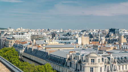 Cityscape view on the beautiful buildings timelapse from gallery lafayette terrace in Paris. Sunny weather at summer day. Rooftop panoramaの写真素材