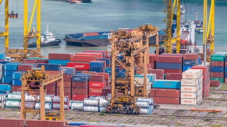 Commercial port of Singapore timelapse. Bird eye panoramic aerial view of busiest Asian cargo port...
