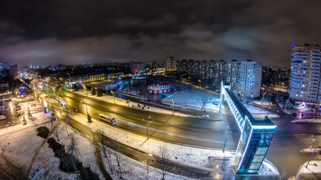 Kharkiv city from above night timelapse at winter. Aerial view of the city center and residential districts. Gagarin avenue traffic. Ukraine.の写真素材