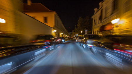 Drive at fast speed at the night streets in downtown timelapse hyperlapse drivelapse. Blured road with lights on high speed. Prague, Czechの写真素材