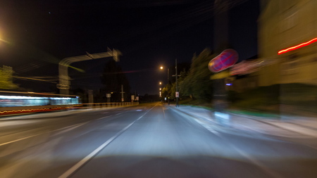 Drive at fast speed at the night streets in downtown timelapse hyperlapse drivelapse. Blured road...