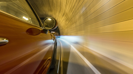 Car moves at fast speed at the night streets timelapse hyperlapse drivelapse. Blured road with lights reflected from car on high speed. Prague, Czechの写真素材