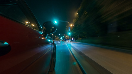 Car moves at fast speed at the night streets timelapse hyperlapse drivelapse. Blured road with lights reflected from car on high speed. Prague, Czechの写真素材