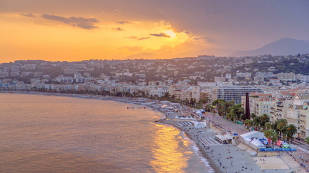 Sunset over Nice city and Mediterranean Sea aerial timelapse. Bay of Angels with dramatic sky from Castle viewpoint, Cote d'Azur, French Riviera, France. Close up viewの写真素材