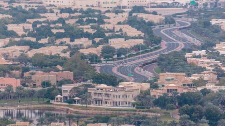 Aerial view of apartment houses and villas in Dubai city timelapse near jumeirah lake towers...