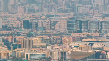 Aerial view of neighbourhood Deira and Dubai creek with typical old and modern buildings timelapse....