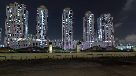 Aerial new estate with neighborhood faculties car park and green garden at the center of Singapore...