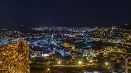 Aerial view from old castlethe in historical city town of Nevsehir night timelapse. Panoramic...