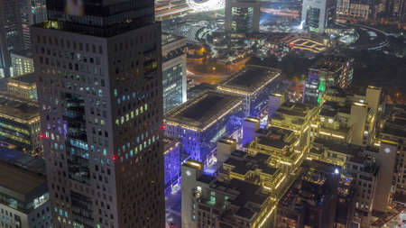 Office tower located in the Dubai International Financial Centre night timelapse