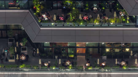 Aerial top view of cozy restaurant in the open air night timelapseの写真素材