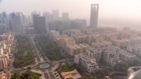 Skyscrapers in Barsha Heights district and low rise buildings in Greens district aerial all day timelapse. Dubai skylineの写真素材