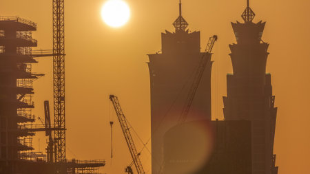Dubais business bay towers at sunset aerial timelapse. Rooftop view of some skyscrapersの写真素材