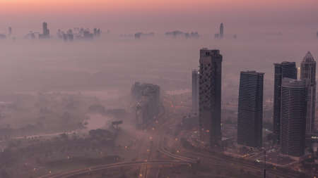 Big crossroad junction between JLT district and Dubai Marina intersected by Sheikh Zayed Road aerial...