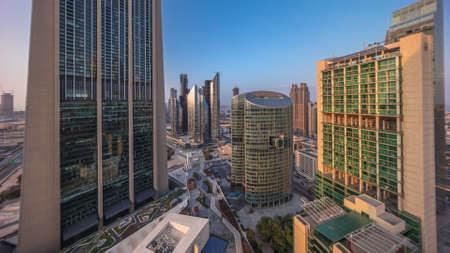 Dubai international financial center skyscrapers with promenade on a gate avenue aerial all day timelapse.の写真素材