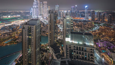 Panorama showing aerial view of a big futuristic city night timelapse. Business bay and Downtownの写真素材