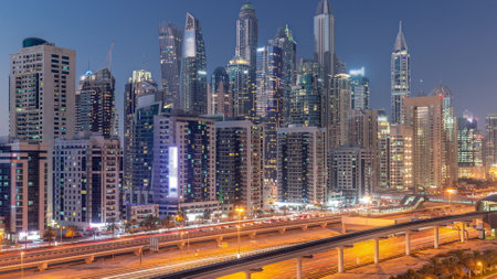 Dubai marina tallest block of skyscrapers day to night timelapse.