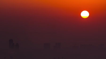 Sunrise close up view over Dubai skyline in the morning, aerial top view from Dubai marina timelapse.の写真素材