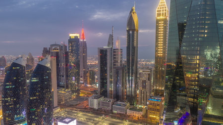 Financial center of Dubai city with luxury skyscrapers day to night timelapse, Dubai, United Arab Emiratesの写真素材
