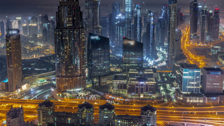 Aerial view of tallest towers in Dubai Downtown skyline during all night with lights turning off. Financial district and business area in smart urban city. Skyscraper and high-rise buildingsの写真素材