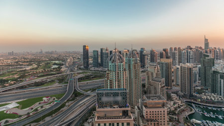 Panorama showing Dubai marina and JLT skyscrapers along Sheikh Zayed Road with huge junction near golf course and media city district aerial. Residential and office buildings from above.の写真素材