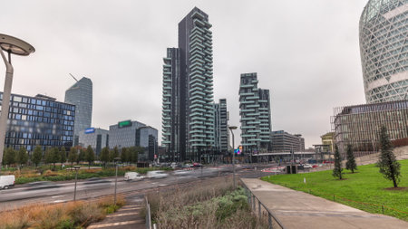 Panorama showing skyscrapers and biblioteca from park with green lawn timelapse. Located between...