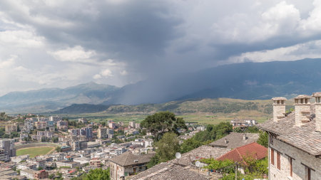 Panorama showing Gjirokastra city from the viewpoint with many typical historic houses of Gjirokaster timelapse.の写真素材