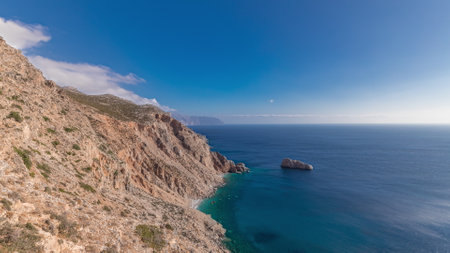 The Hozoviotissa Monastery standing on a rock over the Aegean sea in Amorgos island timelapse hyperlapse, Greece.の写真素材