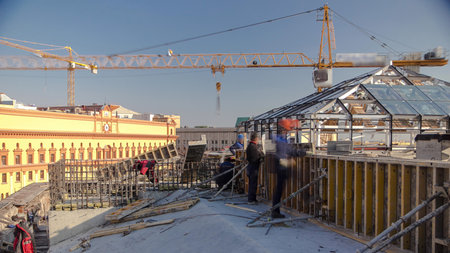 Yellow tower crane. Steel bar rebar metal frame reinforcement for concrete at construction site...
