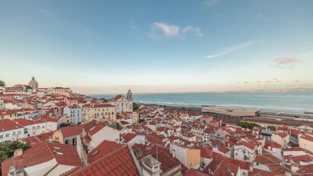 Panorama showing aerial view of Alfama in Lisbon timelapse during sunset.の写真素材