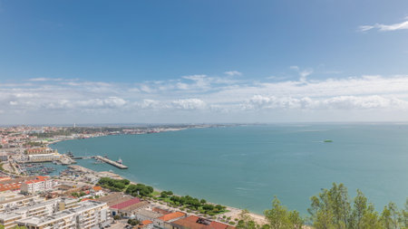 Panorama showing aerial view of marina and city center timelapse in Setubal, Portugal.