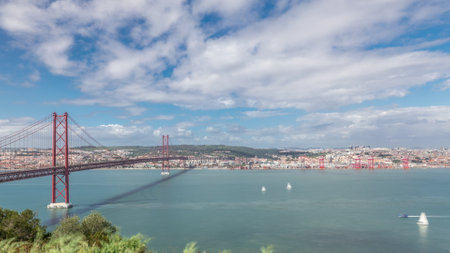 Panorama showing Lisbon cityscape and Tagus river timelapse with 25 of April bridgeの写真素材