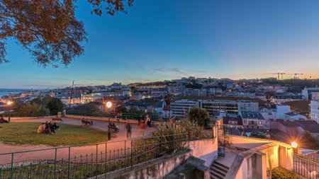 Panorama showing Jardim do Torel day to night timelapse with views to the city center of Lisbon after sunset. Portugalの写真素材