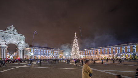 Panorama showing Commerce square illuminated and decorated at Christmas time in Lisbon night timelapse. Portugalの写真素材