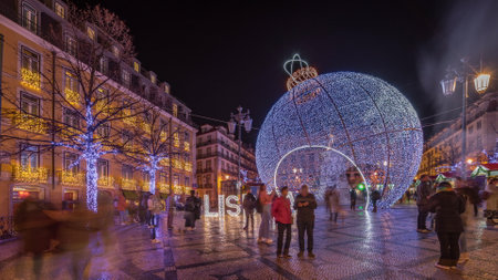 Panorama showing Christmas decorations with big ball on Luis De Camoes square night timelapse.の写真素材