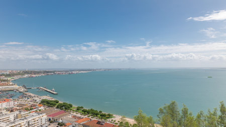 Panorama showing aerial view of marina and city center timelapse in Setubal, Portugal.