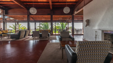 Panorama showing Interior of a modern hotel cafe bar restaurant with piano and fireplace timelapseの写真素材