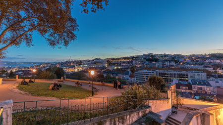 Panorama showing Jardim do Torel day to night timelapse with views to the city center of Lisbon after sunset. Portugalの写真素材