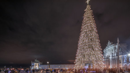 Panorama showing Commerce square illuminated and decorated at Christmas time in Lisbon night timelapse. Portugalの写真素材
