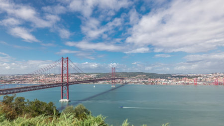 Panorama showing Lisbon cityscape and Tagus river timelapse with 25 of April bridgeの写真素材