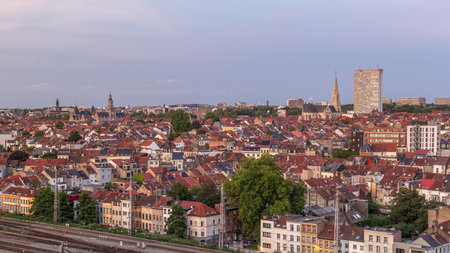 Aerial day to night timelapse panorama over Brussels skyline in Schaerbeek with Saint-Servais Church and Town Hallの写真素材