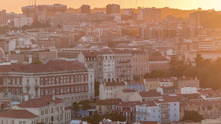 Aerial view of Lisbon skyline with Amoreiras shopping center towers. Historic buildings district with trees timelapseの写真素材