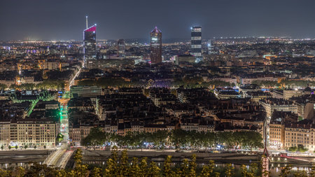 Panoramic aerial view of Lyon with skyscrapers from Fourviere Hill at night. France