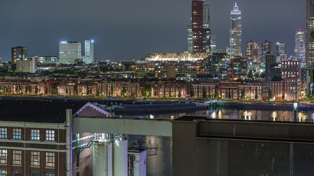 Panoramic night aerial timelapse of Katendrecht peninsula and Maashaven harbour in Rotterdam, The Netherlands.の写真素材