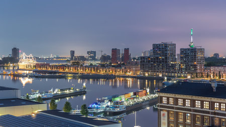 Aerial view over towers in Maashaven night to day timelapse in Rotterdamの写真素材