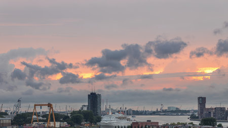 Aerial timelapse of Maashaven harbour during sunset in Rotterdam, The Netherlandsの写真素材