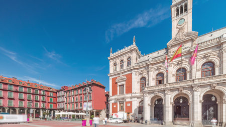Town hall facade with flags in Plaza Mayor, Valladolid, Spainの写真素材